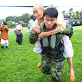 An elderly man is carried from a helicopter to a high school in Chishan, in Taiwan's Kaohsiung county on August 10, 2009 after being airlifted from the southern village of Shiao Lin. (AFP/AFP/Getty Images)