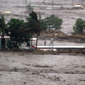 A man stands on a roof as he awaits rescue in heavy flooding in Taimali, south-eastern Taiwan's Taitung county on August 8, 2009 during Typhoon Morakot. (AFP/AFP/Getty Images)