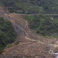 A massive landslide is seen across a mountain road in Pingtung county, southern Taiwan, Monday, Aug. 10, 2009. (AP Photo)