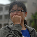 A distraught woman waits for word of her missing father from Shiao Lin village, which was covered in a landslide from Typhoon Morakot in Kaohsiung county, southern Taiwan, at a rescue landing zone on Monday, Aug. 10, 2009. (AP Photo)