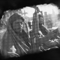 Taliban fighters with AK-47 assault rifles speed through the streets of Kabul, 1996. © David Turnley
 
