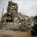 A motorist drives past one of the buildings destroyed during the Israeli Defence Force's attack on southern Beirut. 18 August 2006. © Anna Branthwaite
 
