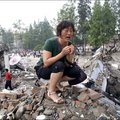 A mother cries on top of what is left of Juyuan Middle School in China's Sichuan province - over 900 students were killed on 12 May 2008 when a 7.9 magnitude earthquake struck. © Ryan Pyle/27 May 2008
 
