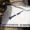 Outside a bar in the city of Goma, eastern Democratic of Republic of Congo, drinkers are warned not to come in armed. 