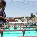 Boy in Ethiopia enjoy a game of table football in Yiannis Neophytou's photograph.