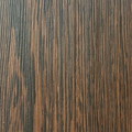 人工合成的產品，構造為夾板上貼上印有木紋的美耐板，具有高耐磨性、抗衝擊性強、耐熱耐污染、防蟲防潮、兼具環保性，花色種類多樣。價格2,500~4,000元/坪 (含工代料)，常用於商業空間。
