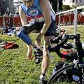 Amputee athlete Jeff Turner of San Francisco puts on his cycling shoes in preparation for the 18-mile bike leg of the triathlon