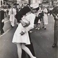 A sailor kisses a nurse