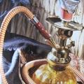 香水瓶、長煙管，火炭，是水煙壺必備的，抽起來呼嚕嚕地響，然後噴出一口水霧。