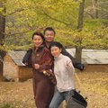 Pao-Gawng with his family walking in the wind along a river bank