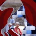 A visitor looks at painted horses at the Horse Parade exhibition at the Jubilee Park in Brussels, Wednesday June 22, 2005. which will travel across Belgium to promote art before being sold for charity. (AP Photo/Geert Vanden Wijngaert)