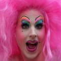 A man in drag costume smiles during Toronto's Pride Day Parade, North America's largest gay pride event in Toronto June 26, 2005. REUTERS/Jorge Uzon