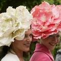 Racegoers enjoy ladies day at Royal Ascot in York, June 16, 2005. Over 300,000 people are expected to attend Royal Ascot which has been moved to York racecourse while the Ascot course is redeveloped. REUTERS/Ian Hodgson