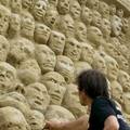 A man works on a sand sculpture during the international sand-sculptures festival in Berlin June 14, 2005. The festival runs from June 6 to July 31. REUTERS/Tobias Schwarz