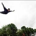 On the trampoline : A French athlete performs on a trampoline installed on the Champs-Elysees, in Paris, during an event to promote the Paris 2012 Olympic bid. (AFP/Olivier Laban-Mattei)