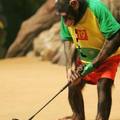 Seven-year-old trained chimpanzee, Rudi, pretends to play golf during 'the animal wonder stage' at the Everland in Yongin, about 50 km (31 miles) south of Seoul, July 6, 2005. REUTERS/You Sung-Ho