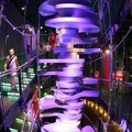 Visitors walk beside a giant mock up of a crankshaft in a car museum at the Volkswagen's car delivery center in Wolfsburg July 13, 2005.  VW brand. REUTERS/Fabrizio Bensch