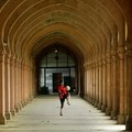 A boy plays with a football in the corridors of the Vijayanagram Hall at Allahabad University in Allahabad, India, Wednesday, July 13, 2005.  (AP Photo/Rajesh Kumar Singh)