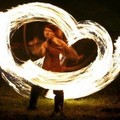 Fire dancers before torching a giant Wicker Man, about 35 feet in height, which took two weeks to build, at the climax of the Wickerman Festival, Kirkcudbright, Scotland at midnight Saturday July 23, 2005. (AP Photo/Andrew Milligan, PA)