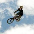 A Colombian jumps with his bike during the summer festival sport activities in Bogota, August 7, 2005. The summer festival runs until August 15. REUTERS/Daniel Munoz