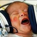 Rock on : One-day-old baby Tomas listens to music as a part of an experimental program that uses musical therapy to ease the stress after birth at the first private hospital in eastern Slovakia. (AFP/Joe Klamar)