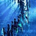 Flag bearers stand in the pouring rain, during the opening ceremony for the 10th World Athletics Championships in Helsinki, Saturday, Aug. 6, 2005. (AP Photo/Jasper Juinen)