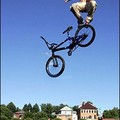 A Russian boy jumps on his bike into a lake in the town Dmitrov, about 70 kms from Moscow. (AFP/Denis Sinyakov)