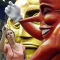 Tina McCrosky works on a Mardi Gras float at Mardi Gras World in Algiers, La.