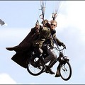 Two persons on a Solex fly in the air in Saint-Hilaire-du-Touvet, in the French Alps during the 32nd Coupe Icare (Icarus Cup) taking place from 22 to 25 September. (AFP/Jean-Pierre Clatot)