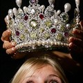  Christies employee Alexandra Jaffray looks up at a diamond, ruby and pearl crown at Christies auction house in London. (AFP/Carl de Souza)