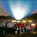 sitting in lawn chairs in front of their car in Middle River on the outskirst of Baltimore, Maryland. Now in its 50th season, Bengies boasts a 52-foot-high-by-120-foot-wide screen, the biggest on the East Coast(AFP/File/Paul J. Richards )