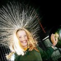  Melanie Baxter, aged 11, holds her hand on a Van Der Graaf generator which causes her hair to raise during a display at Melbourne's Scienceworks Museum. (AFP/William West)