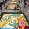  Petals of a total of 150,000 roses in various colors were sprinkled over 21 pictures drawn on the esplanade along a canal, creating a 200-meter flower carpet. (AP Photo/Katsumi Kasashara)