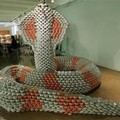 Scaling Back Hunger,' a cobra snake made entirely of cans, Thursday, Nov. 10, 2005, at 'Canstruction,' the 13th annual NYC Design and Build competition in New York. (AP Photo/Kathy Willens)