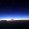 手機所照的最後一張夕陽西下於雲層