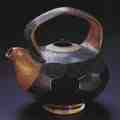 Teapot with faceted body, 2002. Mark Shapiro