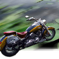 Motorcycle cruising on the lake, background motion blur & wheel spin radial blur