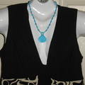 The Dress was made in USA; the turquoise bead necklace was made by me in USA.