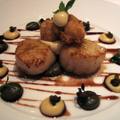Roasted sea scallops served with caper and raisin dressing, 
cauliflower pur'ee and a reduction of port and red wine