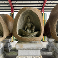 Three statues of Bodhisattvas in front of Illuminati Temple in Xizhi 