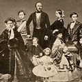 Prince Albert of Saxe-Coburg-Gotha, Queen Victoria, and their 9 children. 
by John Jabez Edwin Mayall (née Jabez Meal) in 1861 the year when Albert died of Crohn's disease 