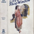 Life’s Shop Window. Victoria Cross. New York: Macaulay Co. (1907). Early or first edition. Original dust jacket; art by Raymond Thayer.