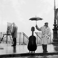 Musician under the rain, 1966 - by Robert Doisneau (1912 – 1994), French